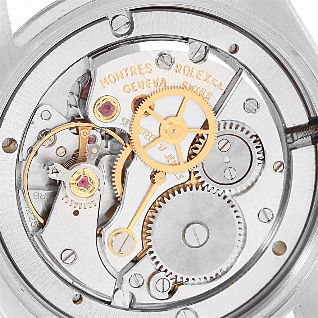 The image shows the inner mechanism and gears of the Vintage Collection model by Rolex at a close-up angle.