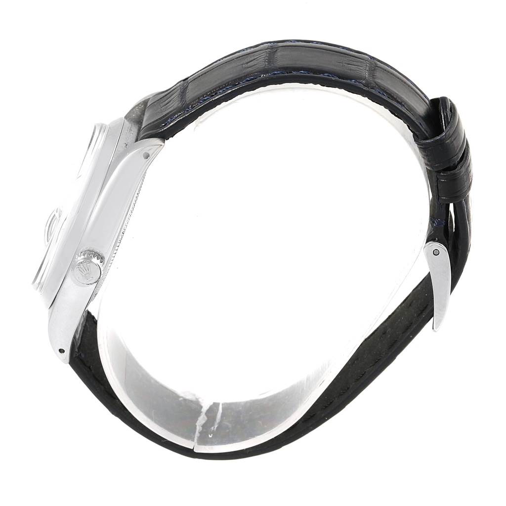 The image shows the side view of a Rolex Vintage Collection 6694 Men's Stainless Steel Blue Dial 6694 Men's Stainless Steel Blue Dial model watch, highlighting its case, crown, and leather strap.