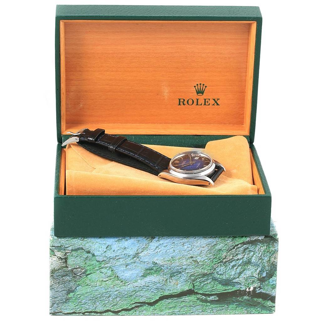 The image shows a Rolex Vintage Collection 6694 Men's Stainless Steel Blue Dial 6694 Men's Stainless Steel Blue Dial watch in its green and wood display box, viewed from the front.