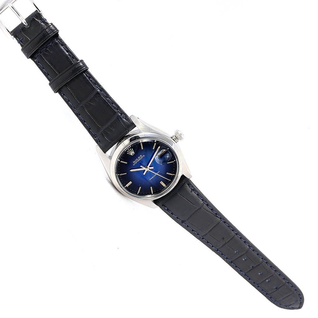 The image shows a top view of the Rolex Vintage Collection 6694 Men's Stainless Steel Blue Dial 6694 Men's Stainless Steel Blue Dial model watch with a blue dial and black leather strap.