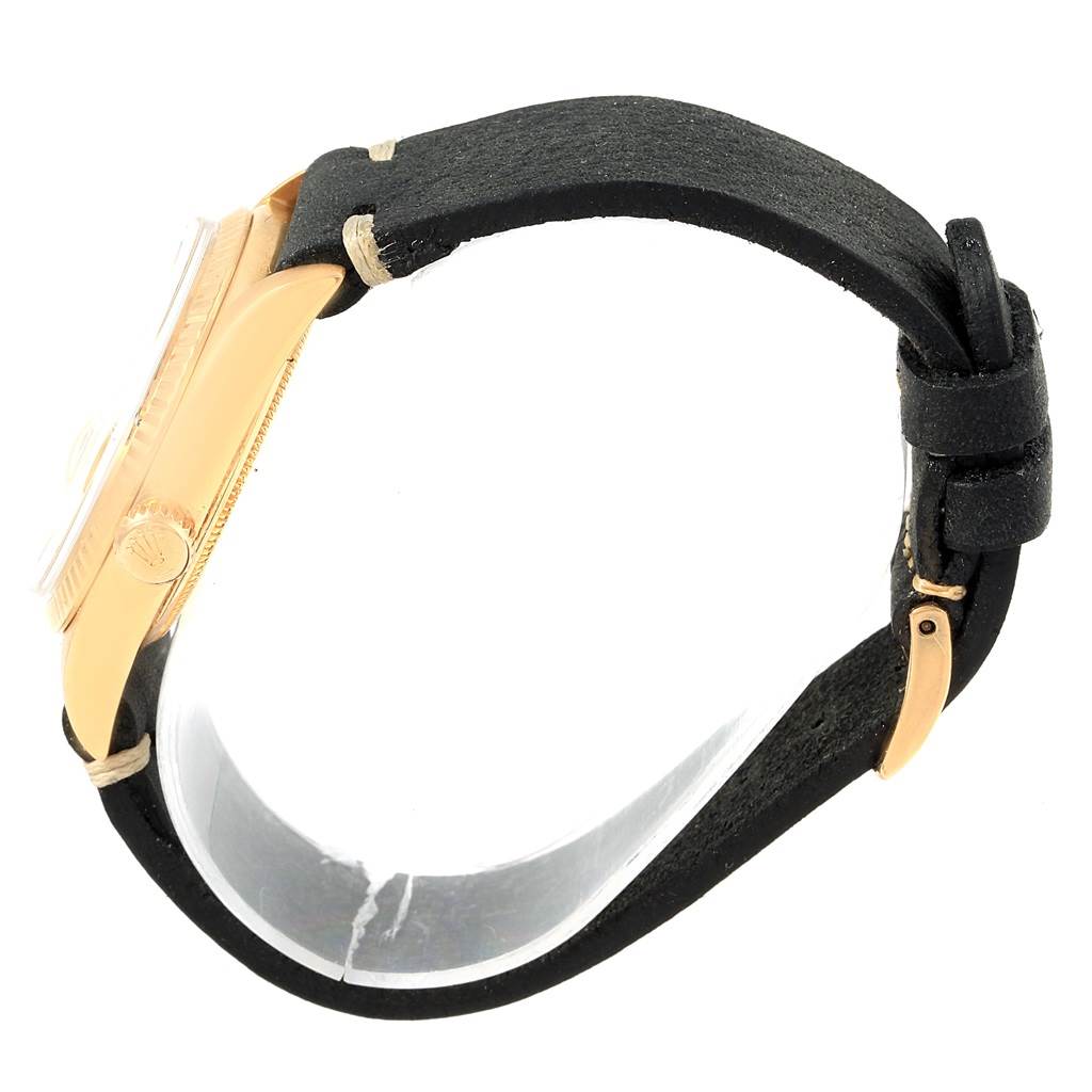 This Rolex Vintage Collection 1807 Men's Yellow Gold Champagne Dial 1807 Men's Yellow Gold Champagne Dial watch is shown from a side angle displaying the case, crown, and part of the black leather strap.