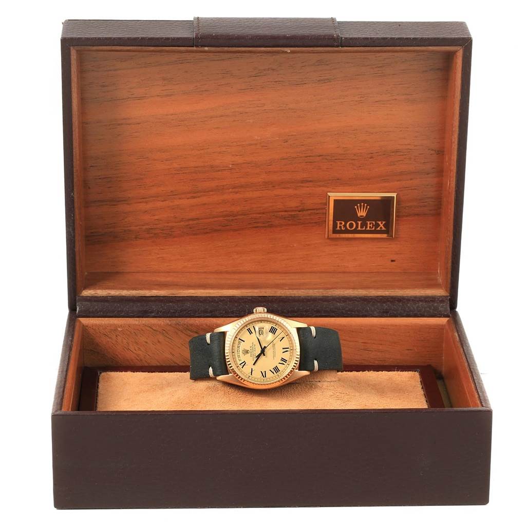 The image shows a Vintage Collection Rolex watch in its open wooden box, focusing on the watch face and strap.