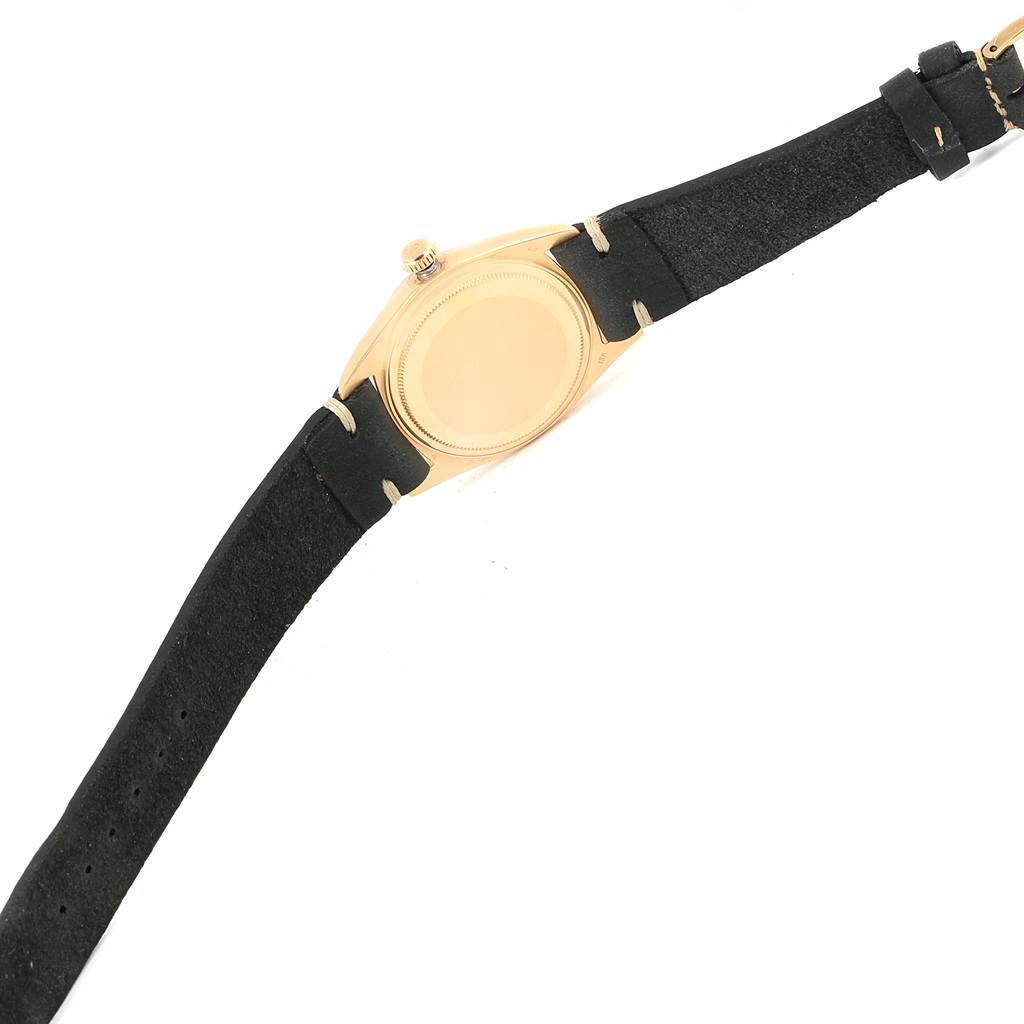 This image shows the back view of the Rolex Vintage Collection 1807 Men's Yellow Gold Champagne Dial 1807 Men's Yellow Gold Champagne Dial watch, including its case and part of the black leather strap.