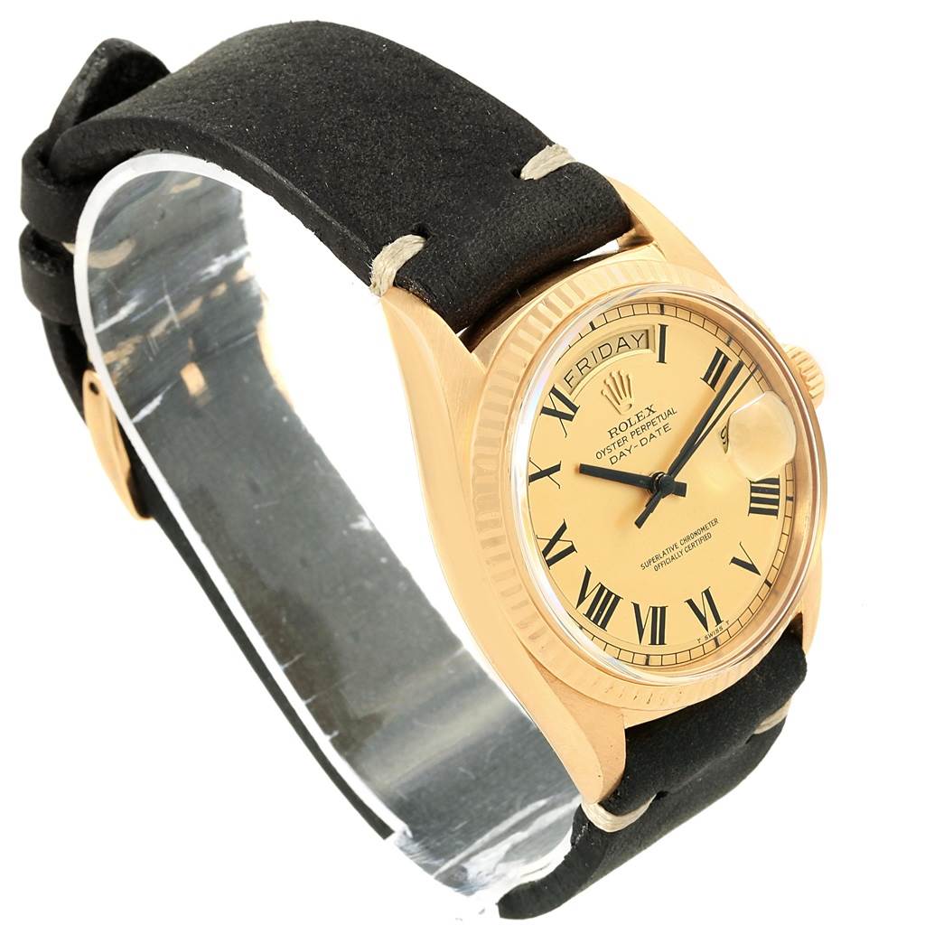 This image shows a side-angle view of a Rolex Vintage Collection 1807 Men's Yellow Gold Champagne Dial 1807 Men's Yellow Gold Champagne Dial watch, displaying the dial, bezel, crown, and leather strap.