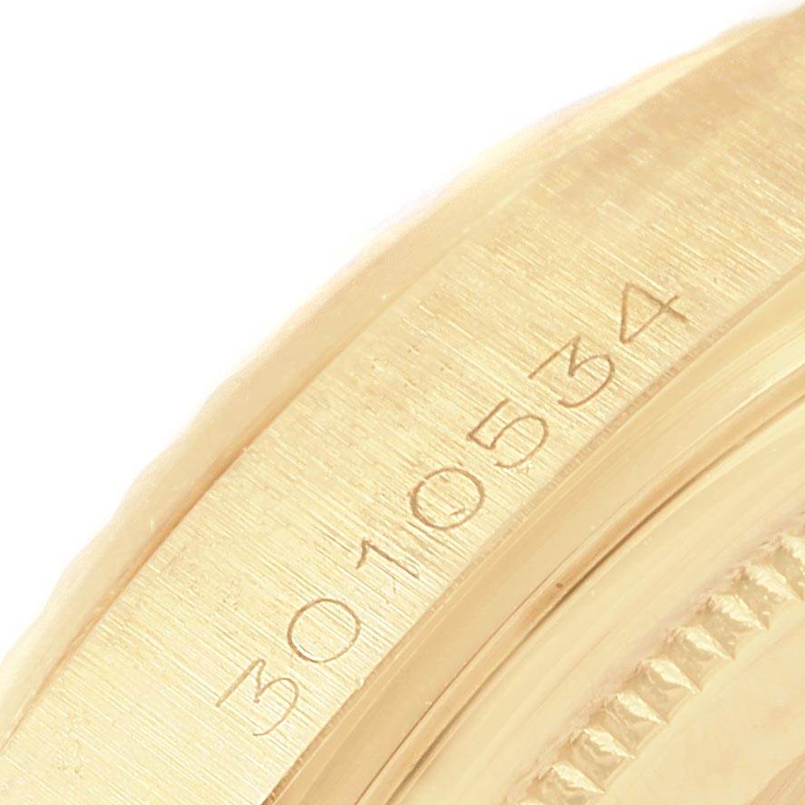 The image shows a close-up of the side of the casing of a Rolex Vintage Collection 1803 Men's Yellow Gold Black Dial 1803 Men's Yellow Gold Black Dial watch, focusing on the engraved serial number.