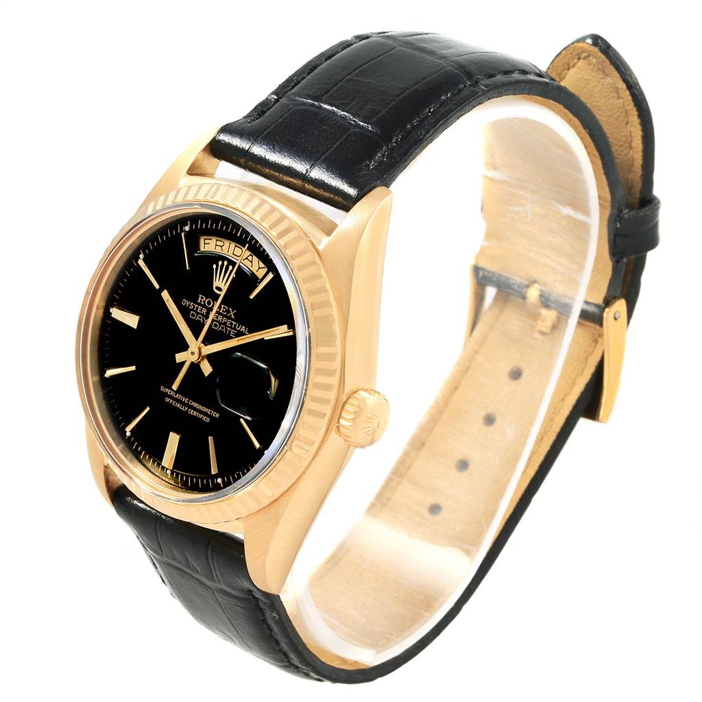 The image shows a side-view angle of the Vintage Collection Rolex watch, displaying the watch face, case, crown, and leather strap.