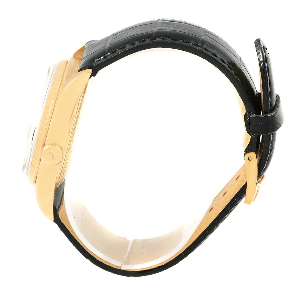 This image shows a side view of the Vintage Collection Rolex watch, highlighting the watch case, crown, and leather strap with buckle.