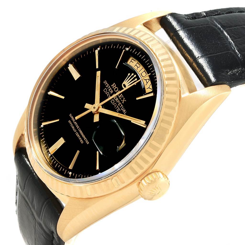 This image shows a Rolex Vintage Collection 1803 Men's Yellow Gold Black Dial 1803 Men's Yellow Gold Black Dial watch at an angled close-up that highlights the black dial, gold case, crown, and part of the leather strap.