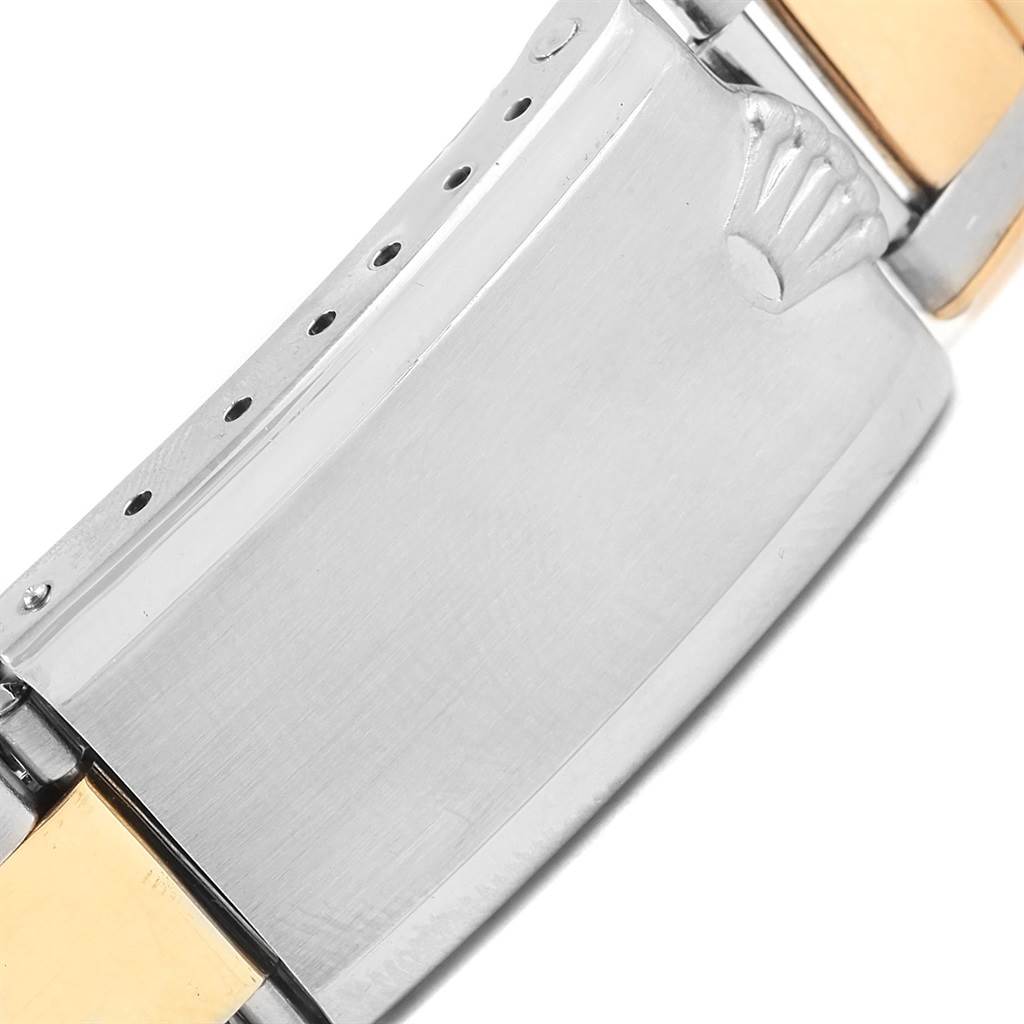 This image shows a close-up of the clasp and part of the band of a Rolex Vintage Collection 1603 Men's Steel and Gold (two tone) Champagne Dial 1603 Men's Steel and Gold (two tone) Champagne Dial watch.
