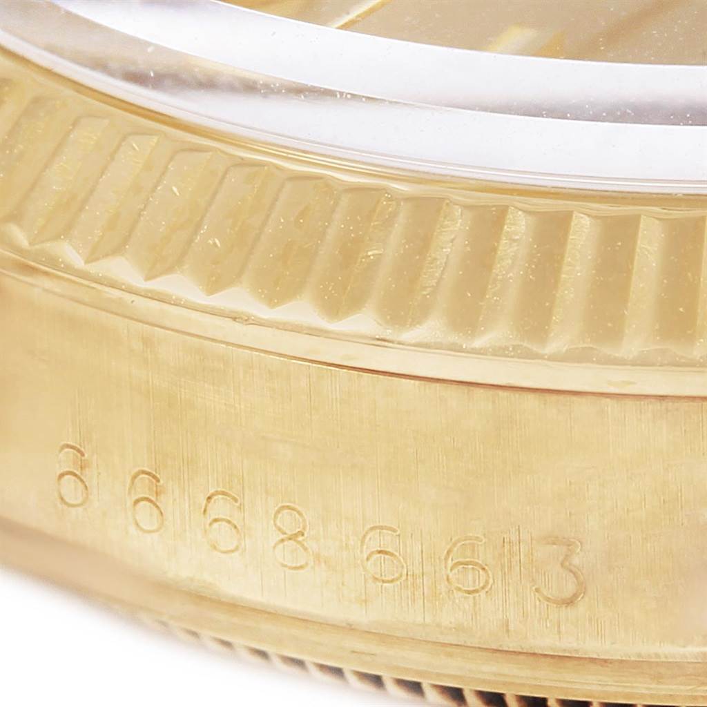 This close-up image shows the side view of the case, serial number, and fluted bezel of the Vintage Collection model by Rolex.