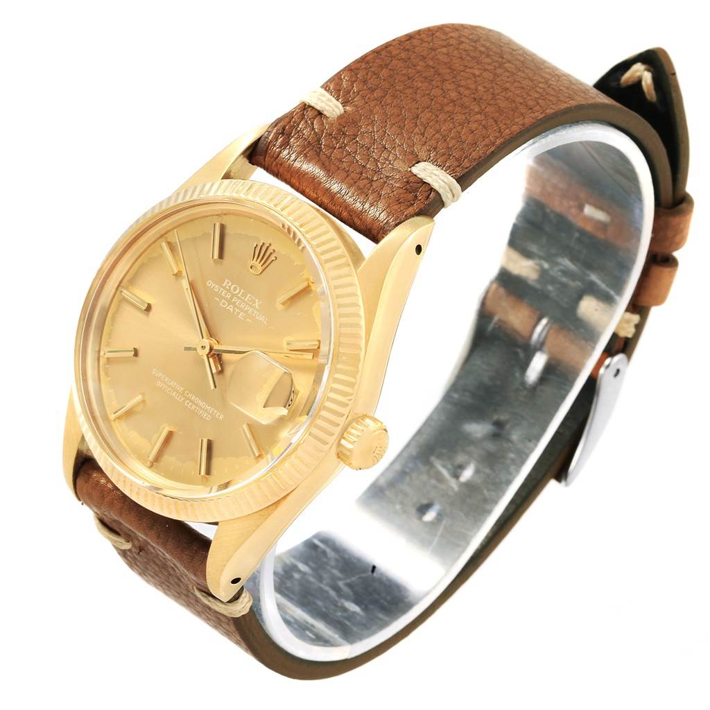 The Vintage Collection model by Rolex is shown from an angled view, highlighting the gold face, crown, and brown leather strap.