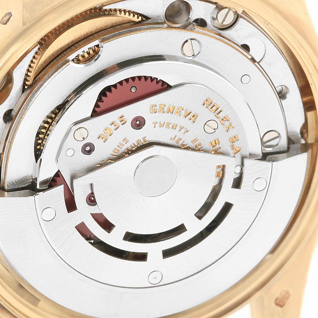 The image shows the intricate inner mechanism of the Rolex Vintage Collection 15037 Men's Yellow Gold Champagne Dial 15037 Men's Yellow Gold Champagne Dial watch, including gears and the balance wheel, viewed from the back.
