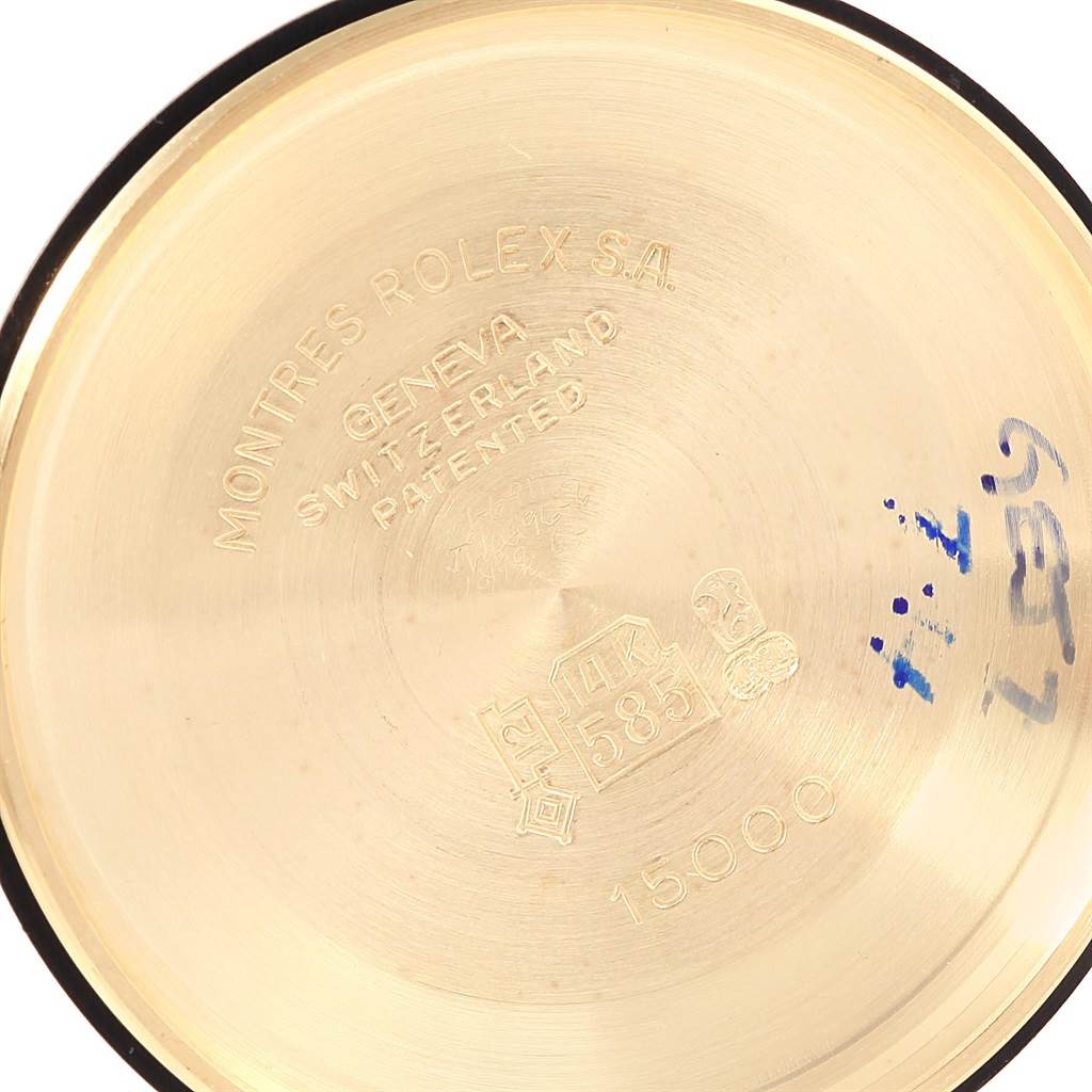 The image shows the inside case back of a Vintage Collection Rolex watch, featuring engravings and reference numbers.