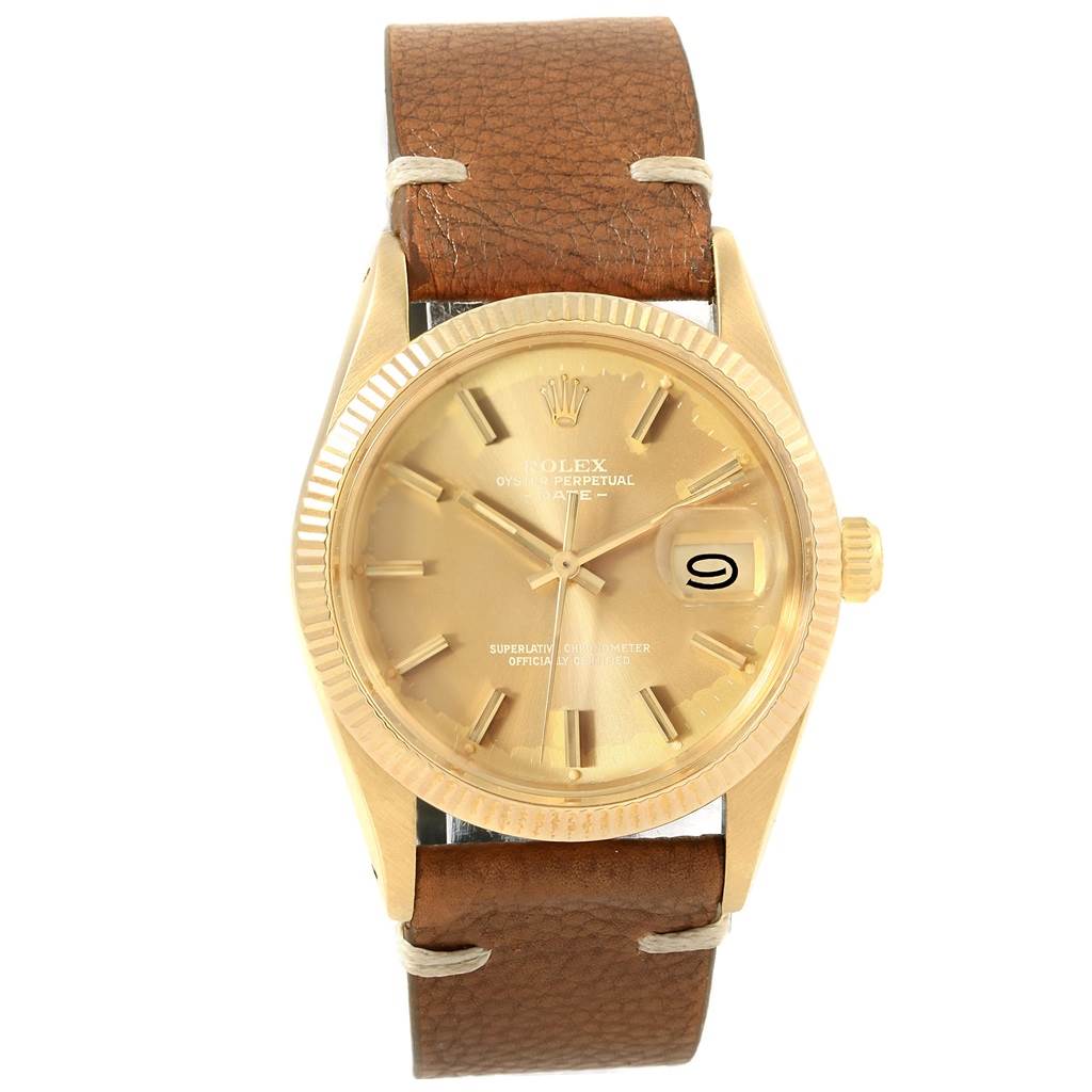 The image shows a front view of a Rolex Vintage Collection 15037 Men's Yellow Gold Champagne Dial 15037 Men's Yellow Gold Champagne Dial watch featuring a gold dial, fluted bezel, and a brown leather strap.