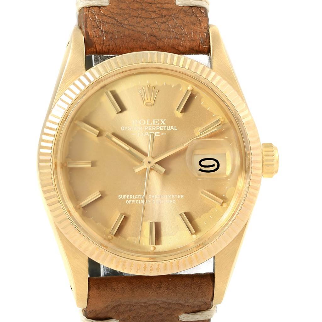 The image shows a front view of a Rolex Vintage Collection 15037 Men's Yellow Gold Champagne Dial 15037 Men's Yellow Gold Champagne Dial watch, featuring a gold dial, date display, and brown leather strap.