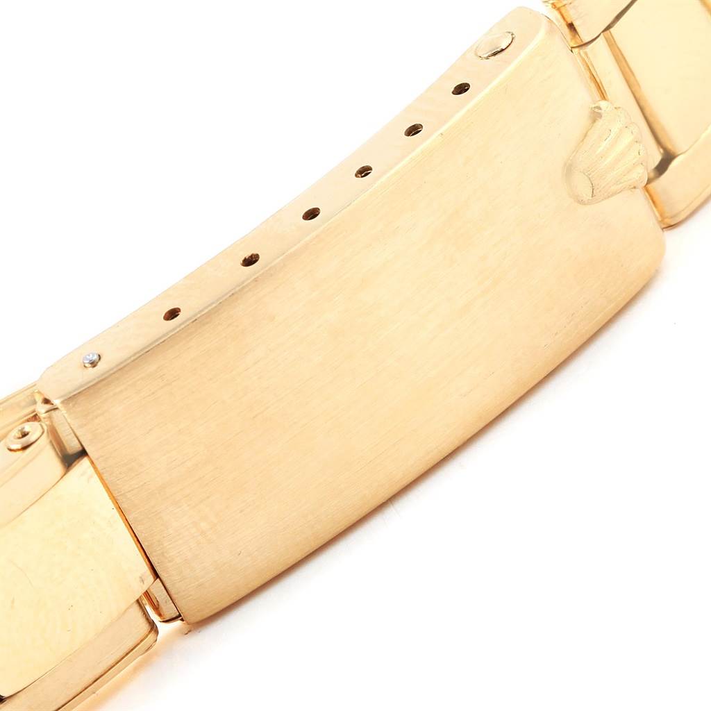 The image shows a close-up of the clasp on a Vintage Collection Rolex watch, focusing on the locking mechanism.