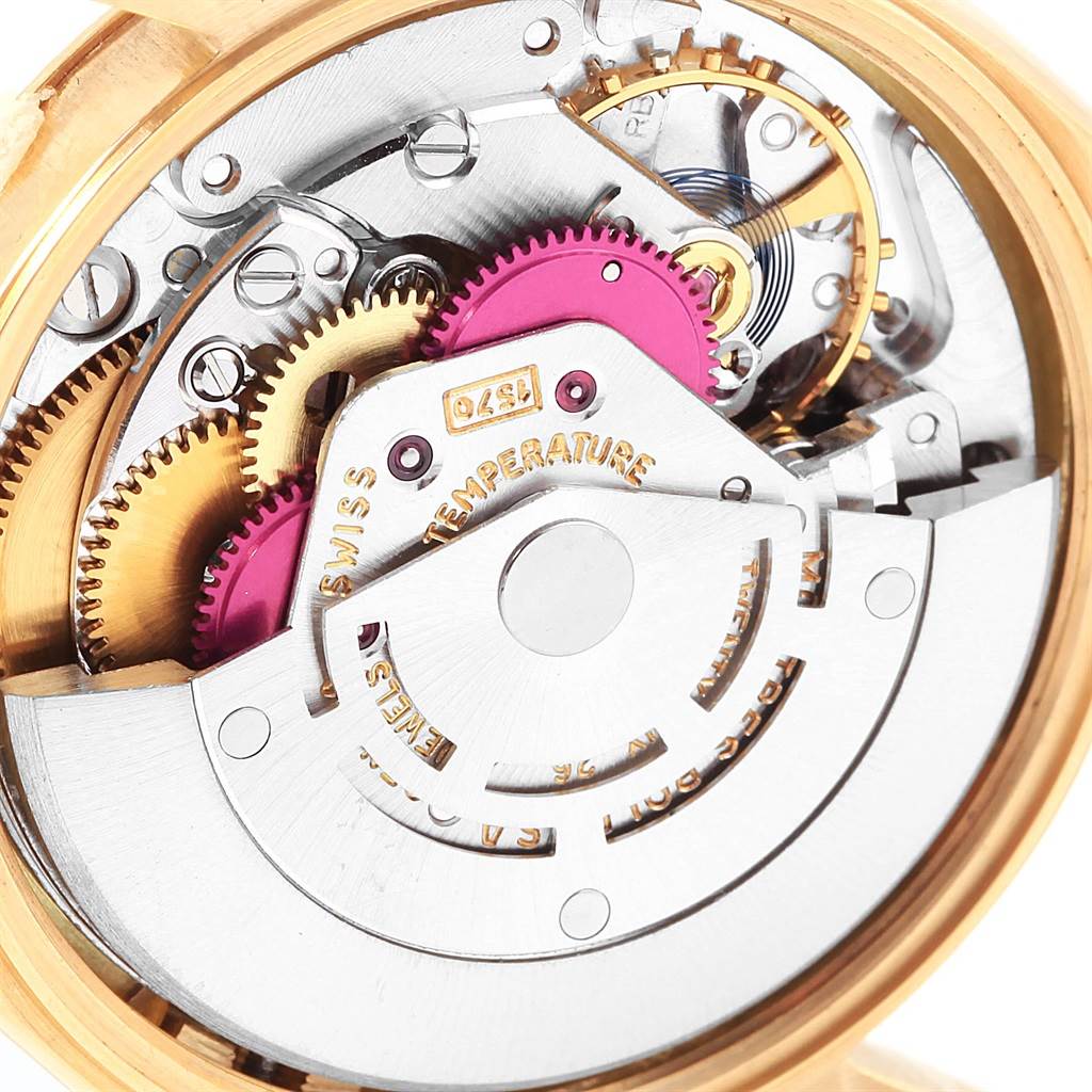 The image shows the internal mechanism of the Rolex Vintage Collection 1503 Men's Yellow Gold Champagne Dial 1503 Men's Yellow Gold Champagne Dial watch from a close-up, showcasing gears and intricate components.
