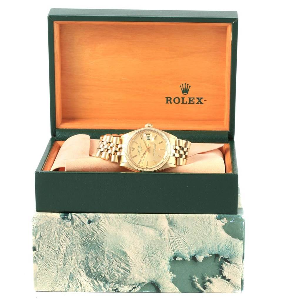 The Vintage Collection Rolex watch is shown from the front in its open box, displaying the face and bracelet.