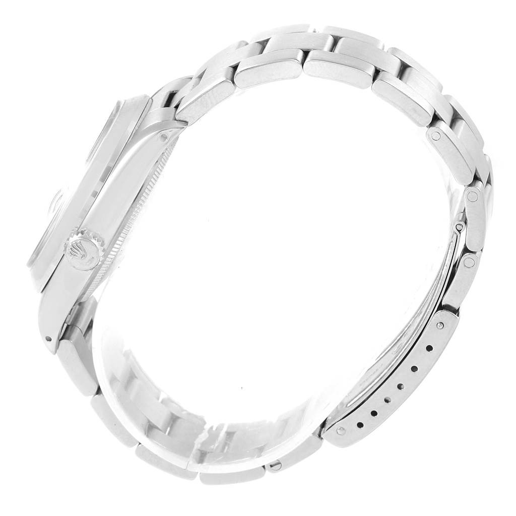 The image shows a side view of the Rolex Vintage Collection 1501 Men's Stainless Steel Silver Dial 1501 Men's Stainless Steel Silver Dial watch highlighting the steel case, crown, and bracelet.