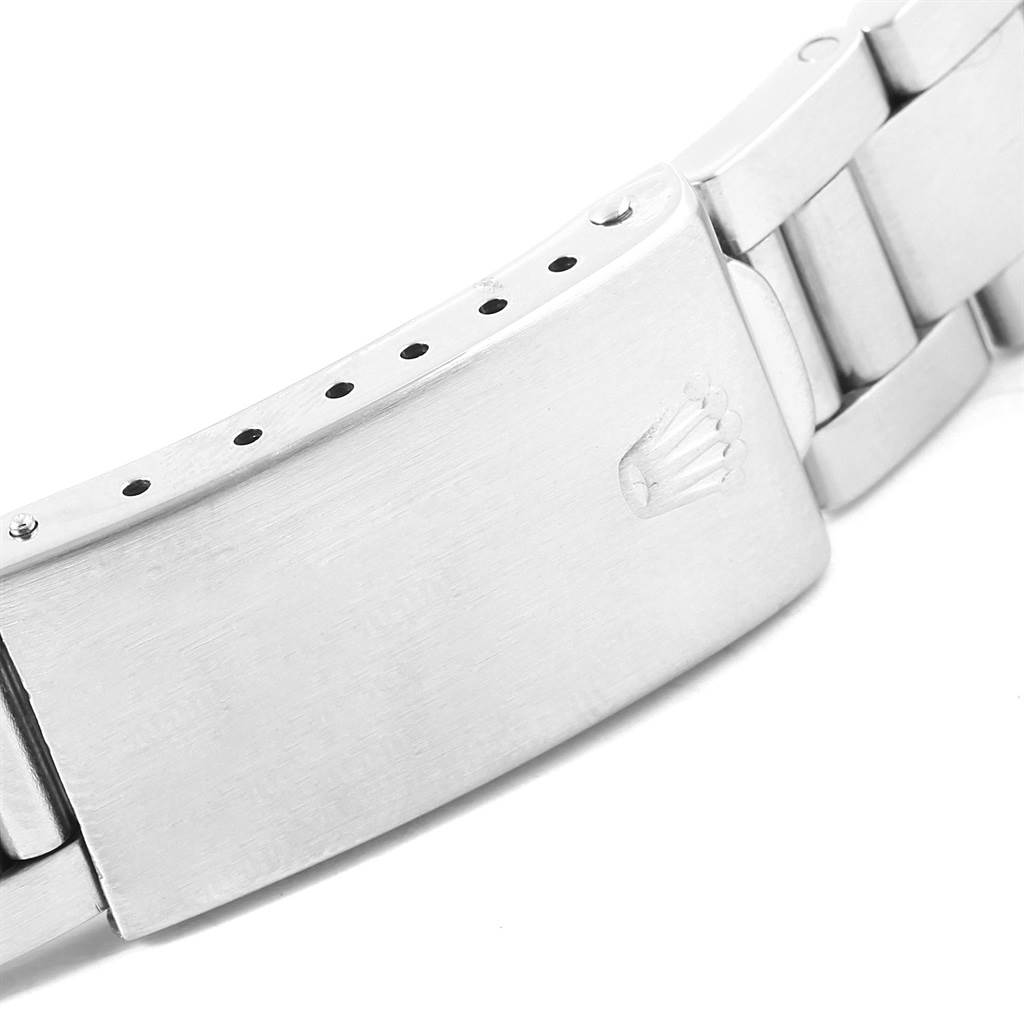 The image shows a close-up of the clasp and part of the bracelet of the Vintage Collection model by Rolex.