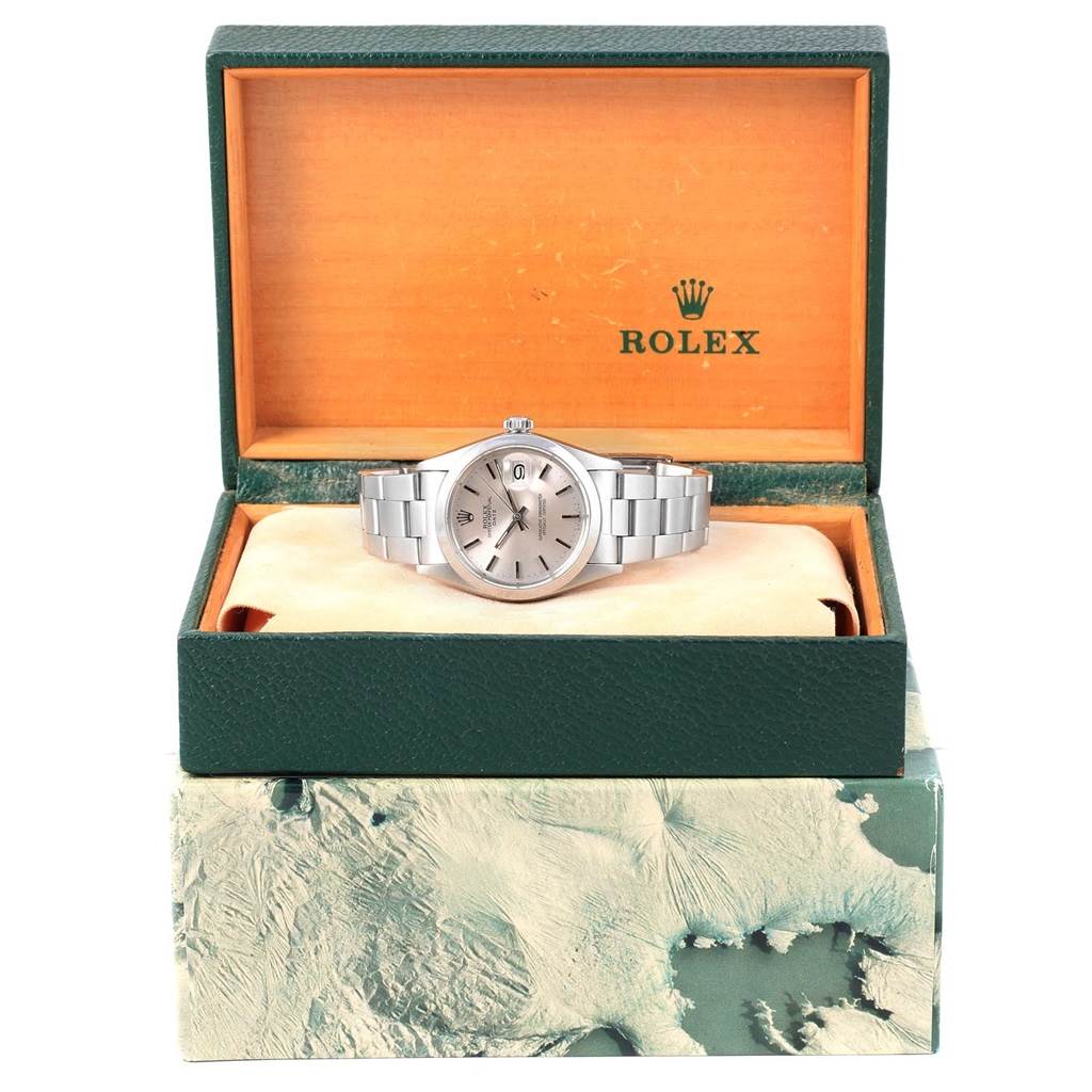 The Rolex Vintage Collection 1501 Men's Stainless Steel Silver Dial 1501 Men's Stainless Steel Silver Dial watch is shown from a front angle, displayed in an open green and orange box with the brand logo.