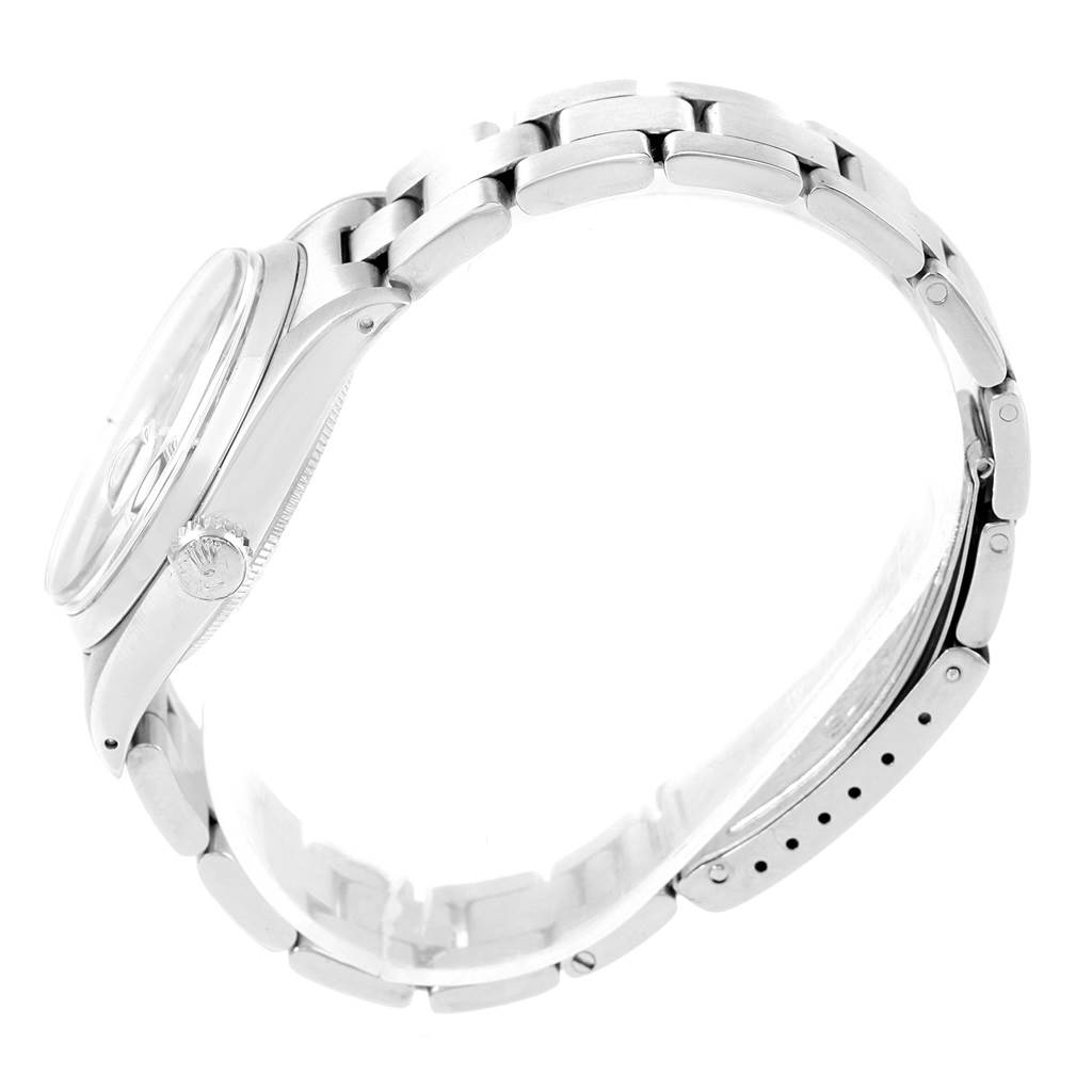 This image shows a side view of a Rolex Vintage Collection 1500 Men's Stainless Steel Grey Dial 1500 Men's Stainless Steel Grey Dial watch, highlighting the case, crown, and bracelet.