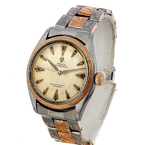 The image shows a Rolex Vintage Collection 6085 Rose Gold Silver Dial 6085 Rose Gold Silver Dial watch from a frontal angle, highlighting its face, bezel, and bracelet.