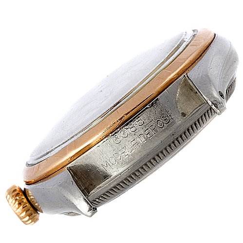 This image shows a side angle of the case and crown of a Vintage Collection Rolex watch.