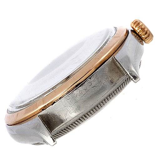 This image shows a side view of a Rolex Vintage Collection 6085 Rose Gold Silver Dial 6085 Rose Gold Silver Dial watch, highlighting its crown, case, and bezel.