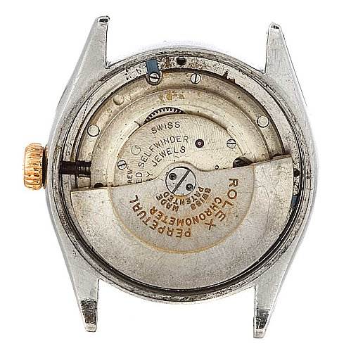 This is a back view of a Rolex Vintage Collection 6085 Rose Gold Silver Dial 6085 Rose Gold Silver Dial model, showing the inner mechanics and movement.