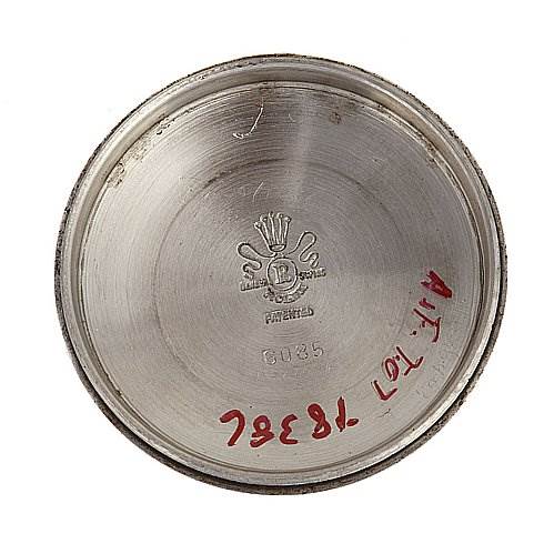 This image shows the inside of the case back from a Rolex Vintage Collection 6085 Rose Gold Silver Dial 6085 Rose Gold Silver Dial model watch.