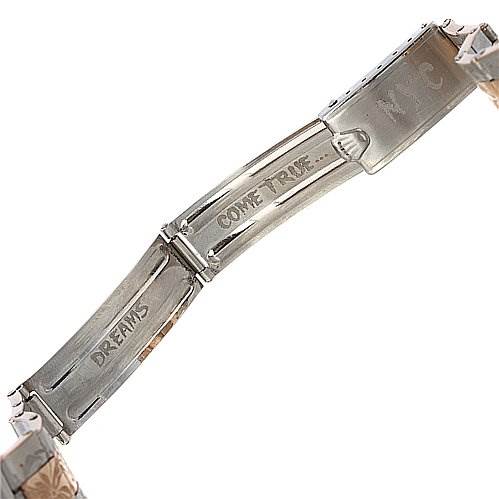 This image shows the inner clasp of the Rolex Vintage Collection 6085 Rose Gold Silver Dial 6085 Rose Gold Silver Dial watch, engraved with the words "DREAMS COME TRUE."