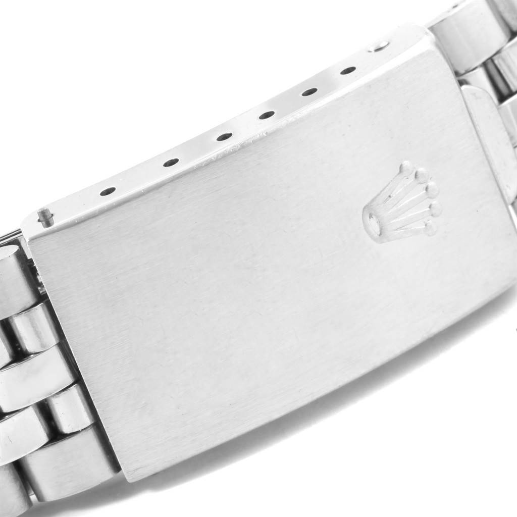 This image shows a close-up of the clasp on the bracelet of a Vintage Collection Rolex watch.
