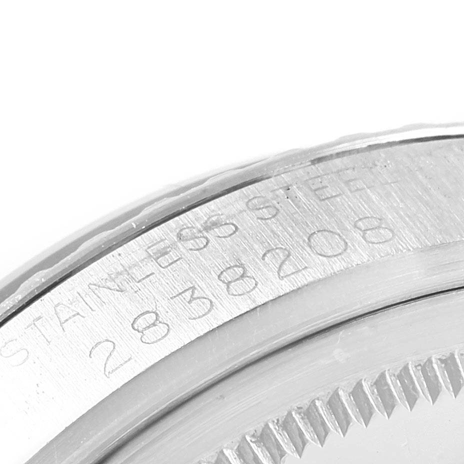 The image shows a close-up of the Rolex Vintage Collection 1603 Men's Stainless Steel Blue Dial 1603 Men's Stainless Steel Blue Dial watch casing, highlighting the stainless steel engraving and serial number.