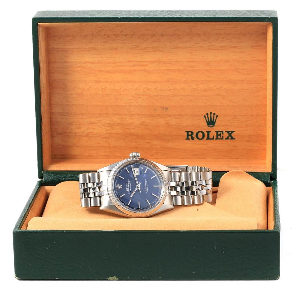 The photo shows a Vintage Collection Rolex watch from a front angle, placed in its opened wooden box.