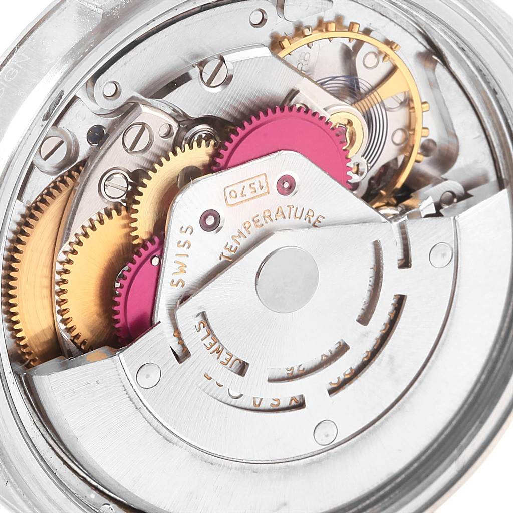 The image shows the intricate internal gears and movement mechanism of the Rolex Vintage Collection 1603 Men's Stainless Steel Blue Dial 1603 Men's Stainless Steel Blue Dial watch.