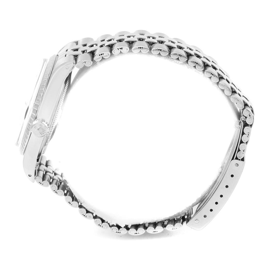 The image shows a side view of the Rolex Vintage Collection 1603 Men's Stainless Steel Blue Dial 1603 Men's Stainless Steel Blue Dial watch, highlighting its case, crown, and bracelet.