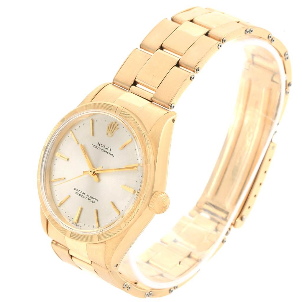 This image shows the Rolex Vintage Collection 1007 Men's Yellow Gold Silver Dial 1007 Men's Yellow Gold Silver Dial model from a three-quarter view, highlighting the dial, crown, and bracelet.