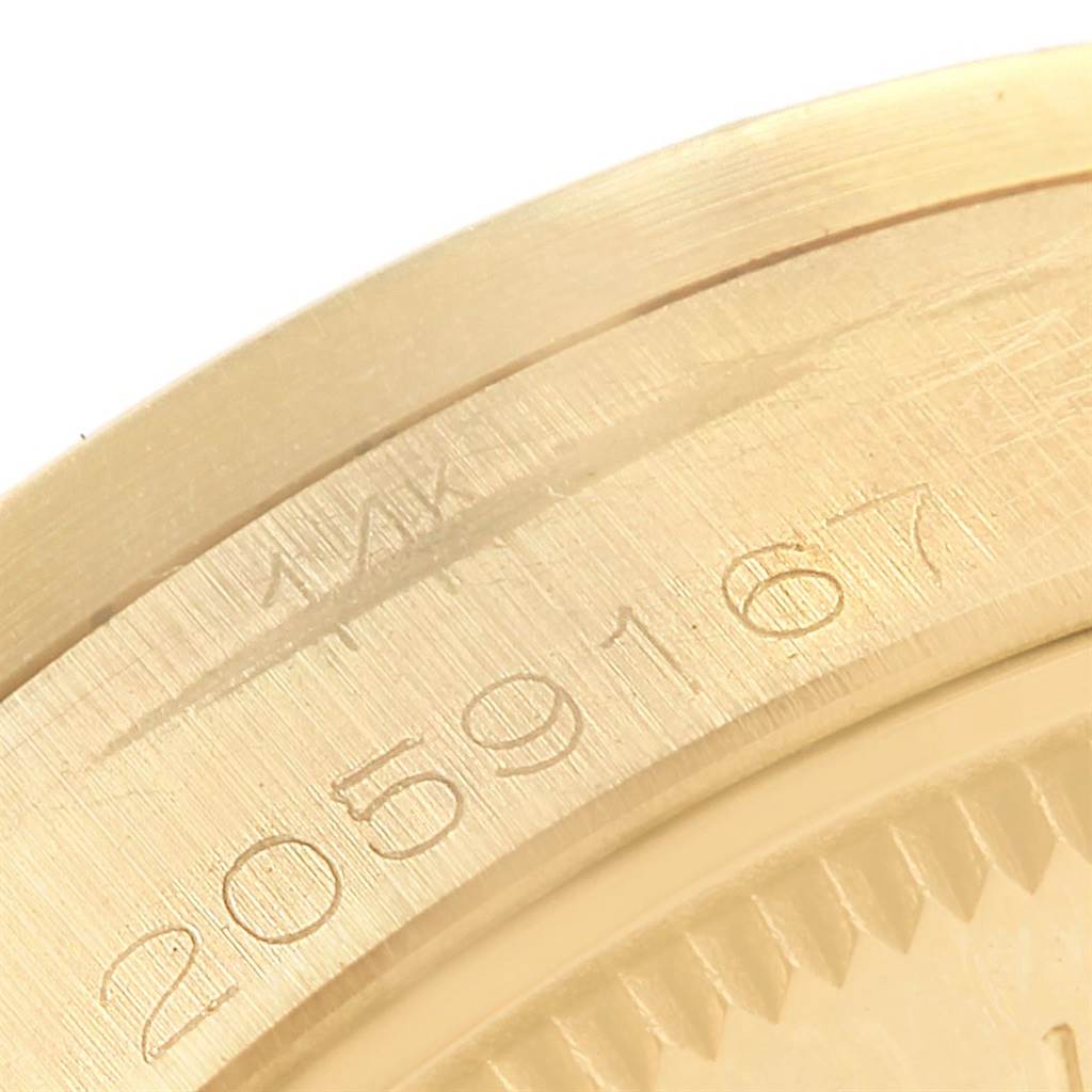 The image shows a close-up of the serial number on the case back of a Rolex Vintage Collection 1007 Men's Yellow Gold Silver Dial 1007 Men's Yellow Gold Silver Dial model watch.