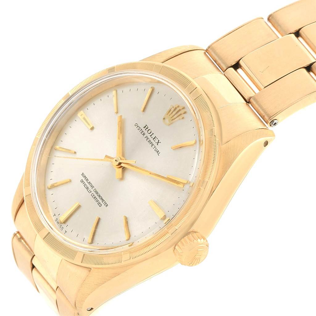 The Rolex Vintage Collection 1007 Men's Yellow Gold Silver Dial 1007 Men's Yellow Gold Silver Dial watch is shown at an angled close-up, displaying the dial, bezel, crown, and part of the bracelet.