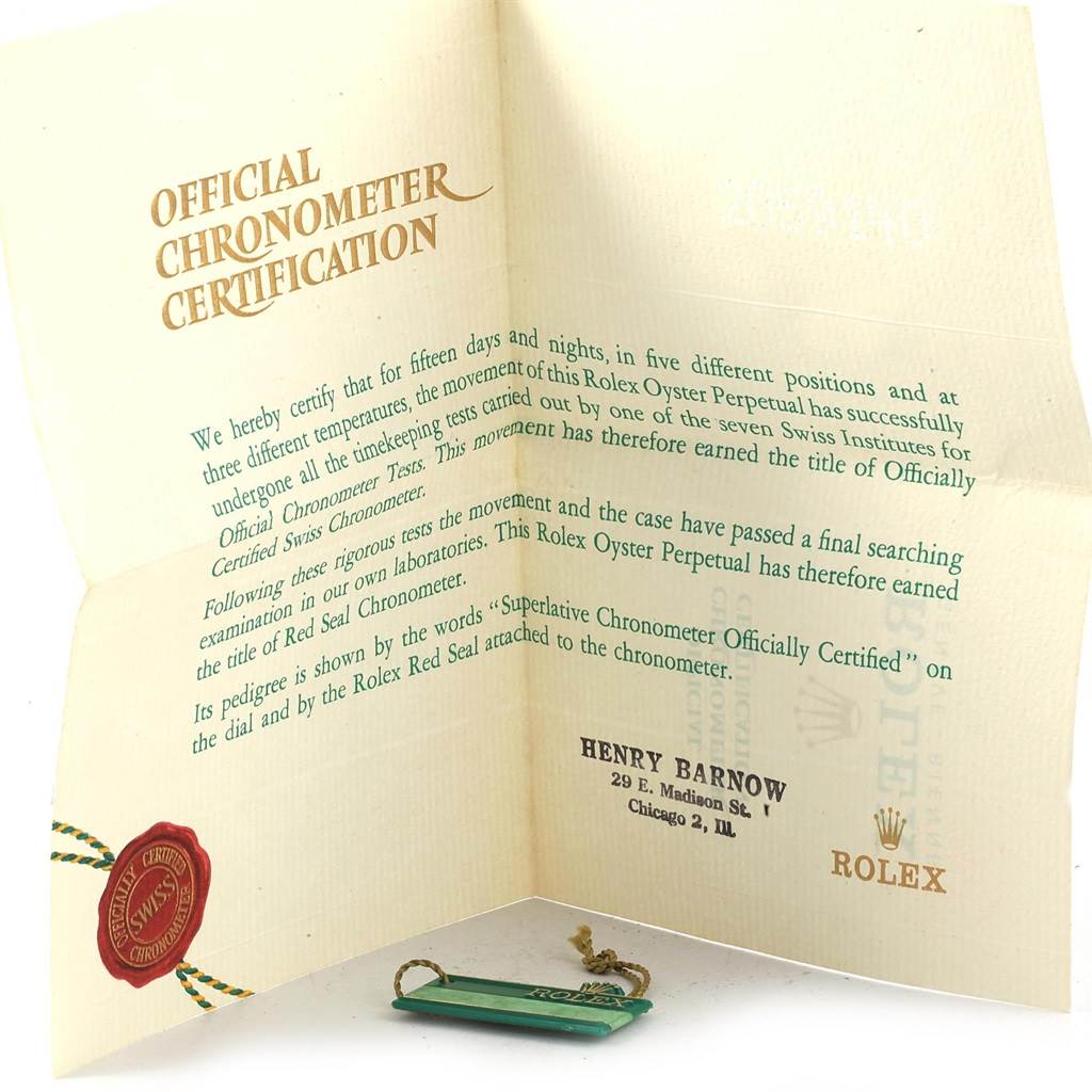 The image shows an official chronometer certification and a tag for the Vintage Collection model by Rolex.