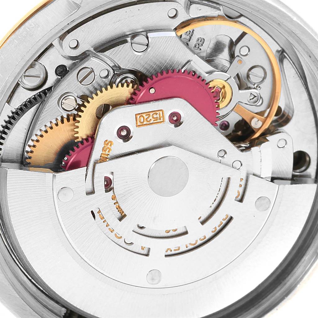 The image shows the internal mechanism and gears of the Vintage Collection model by Rolex from a top-down view.