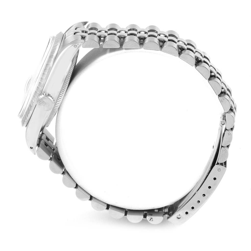 This side angle view of the Rolex Vintage Collection 16030 Men's Stainless Steel Silver Dial 16030 Men's Stainless Steel Silver Dial watch shows the case, bezel, crown, and a portion of the band.