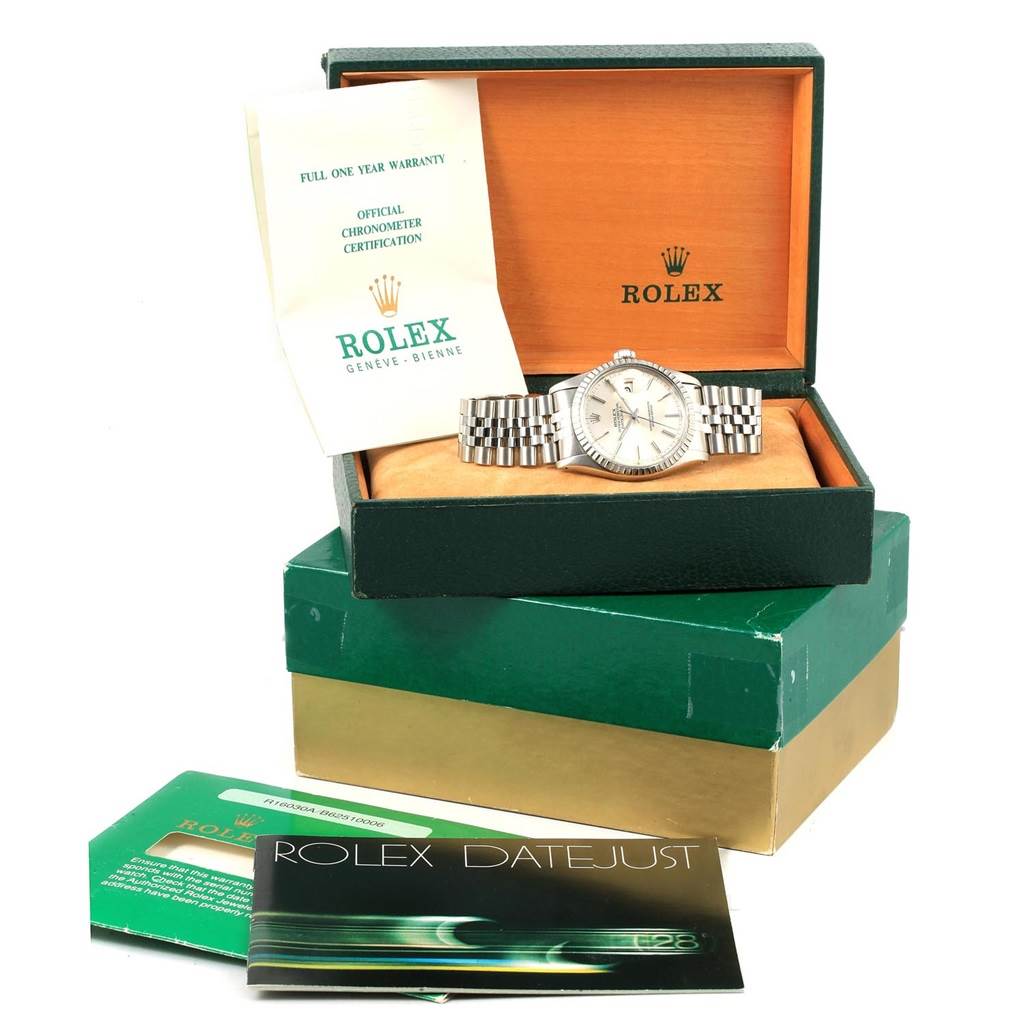 The image shows a Vintage Collection Rolex watch with its box, warranty, chronometer certification, and Datejust booklet.