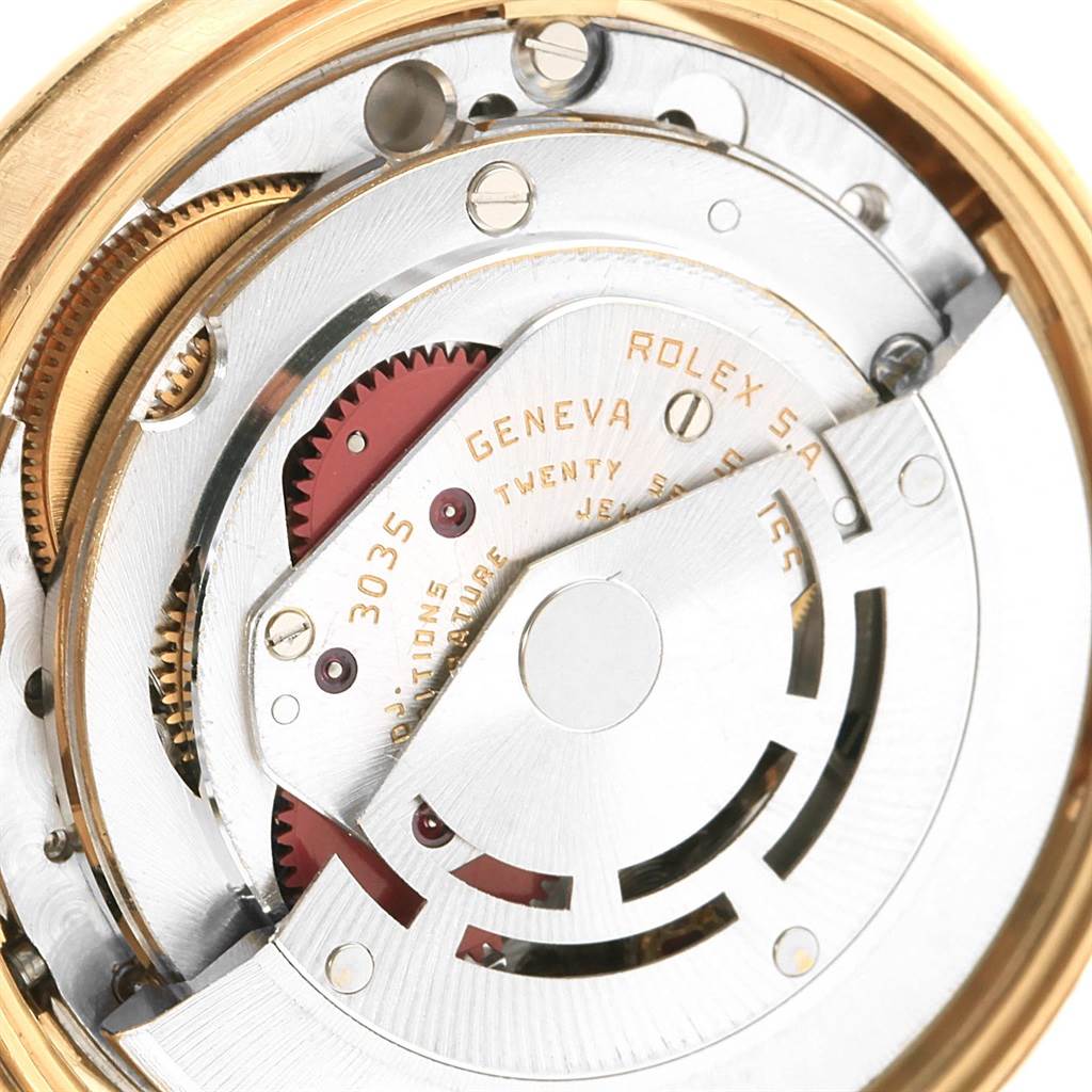 This close-up image shows the intricate internal movement components of a Vintage Collection Rolex watch.