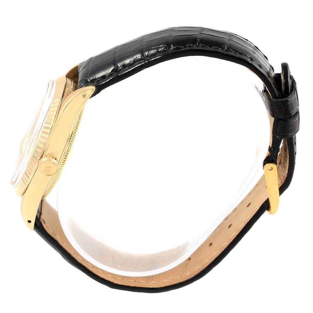 The image shows a side view of a Rolex Vintage Collection 15037 Men's Yellow Gold Champagne Dial 15037 Men's Yellow Gold Champagne Dial watch featuring its gold case, crown, and black leather strap.