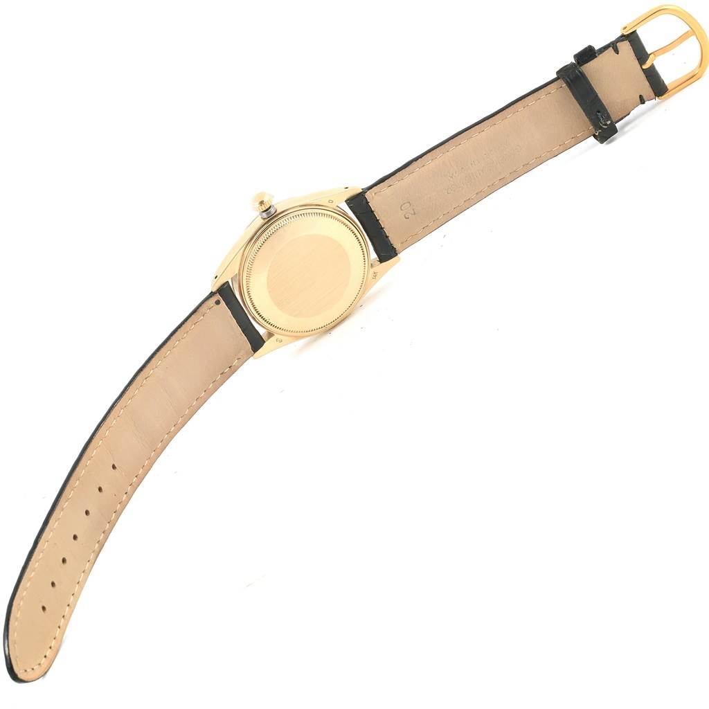 This image shows the back view of a Rolex Vintage Collection 15037 Men's Yellow Gold Champagne Dial 15037 Men's Yellow Gold Champagne Dial watch with its leather strap fully extended.