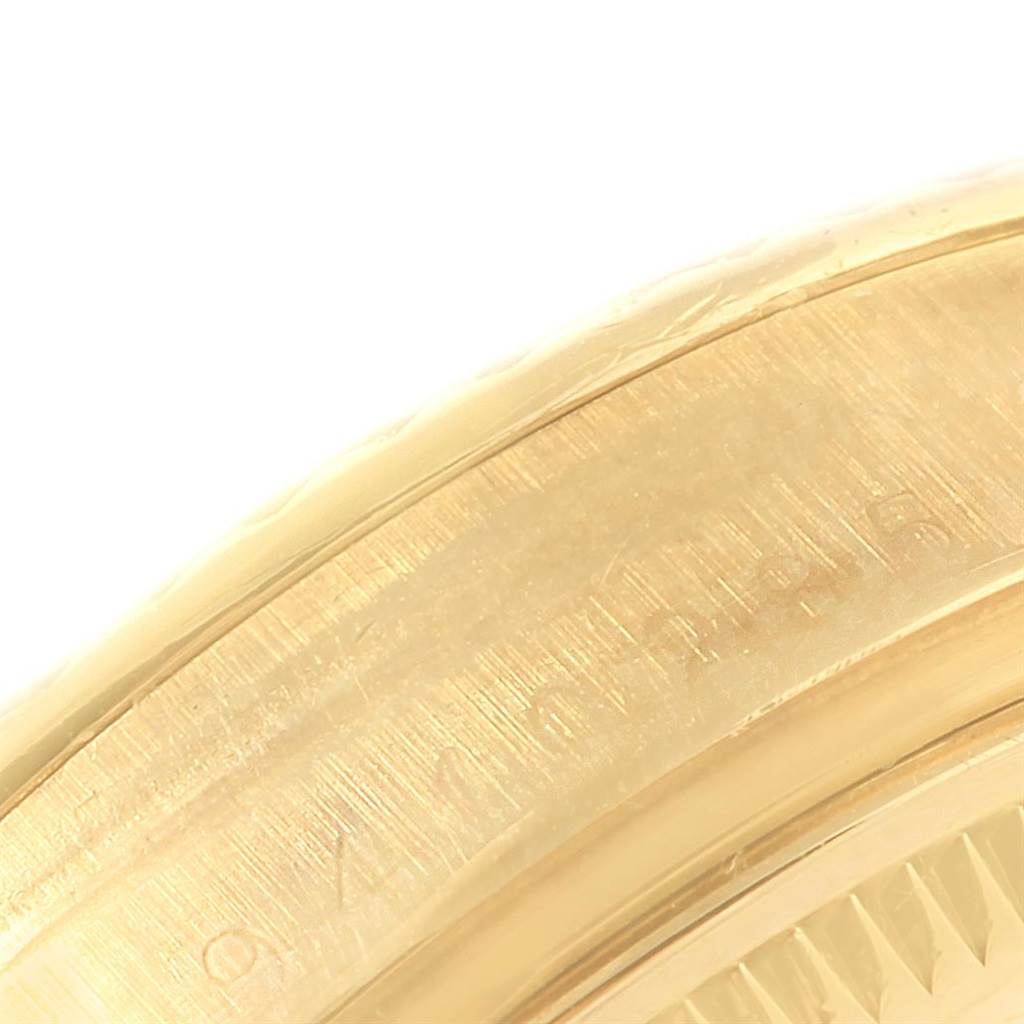 This close-up image shows the gold casing of a Rolex Vintage Collection 15037 Men's Yellow Gold Champagne Dial 15037 Men's Yellow Gold Champagne Dial watch, highlighting its detailed craftsmanship.