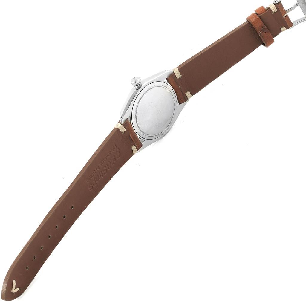 This image shows the backside of the Rolex Vintage Collection 6694 Men's Champagne Dial 6694 Men's Champagne Dial watch, including its stainless steel case and brown leather strap.