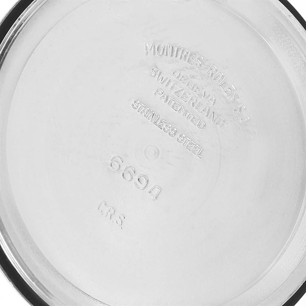 The image shows the inside of the case back of a Vintage Collection model by Rolex, displaying model number 6694.